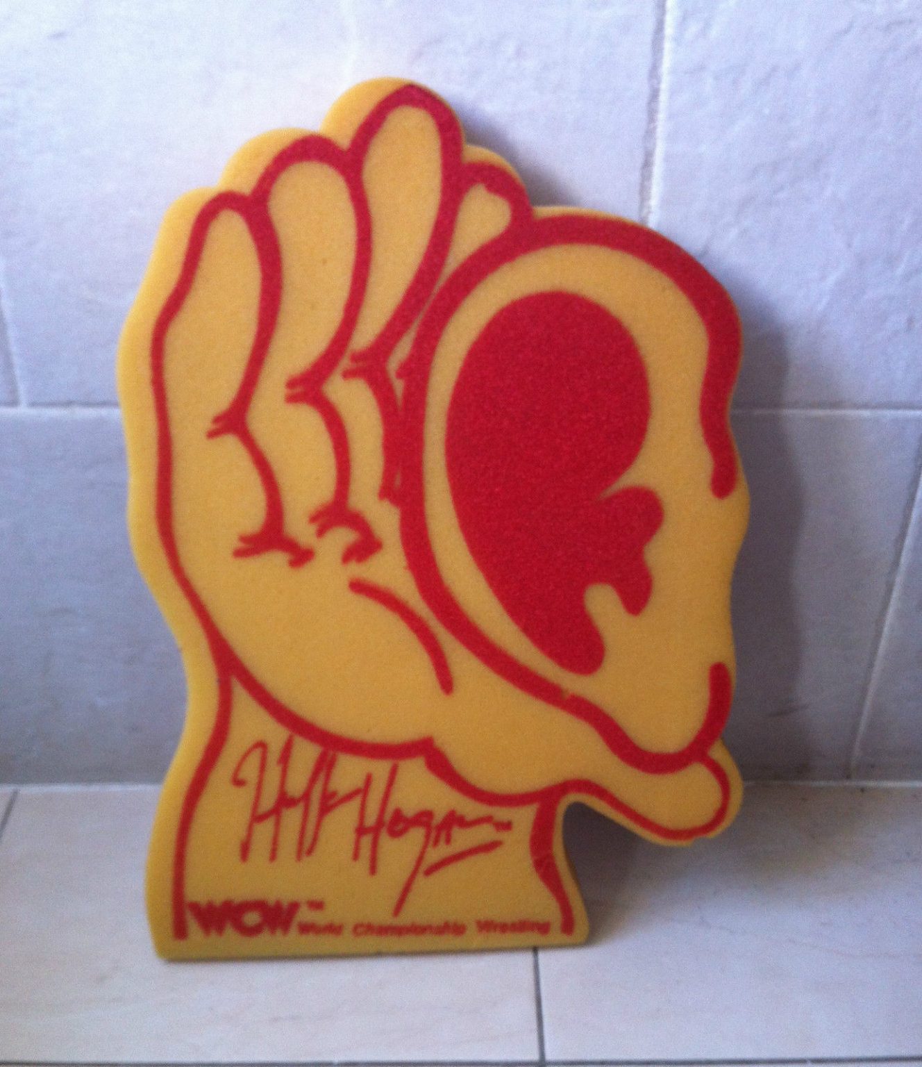 hulk-hogan-foam-ear-and-hand-someone-bought-this